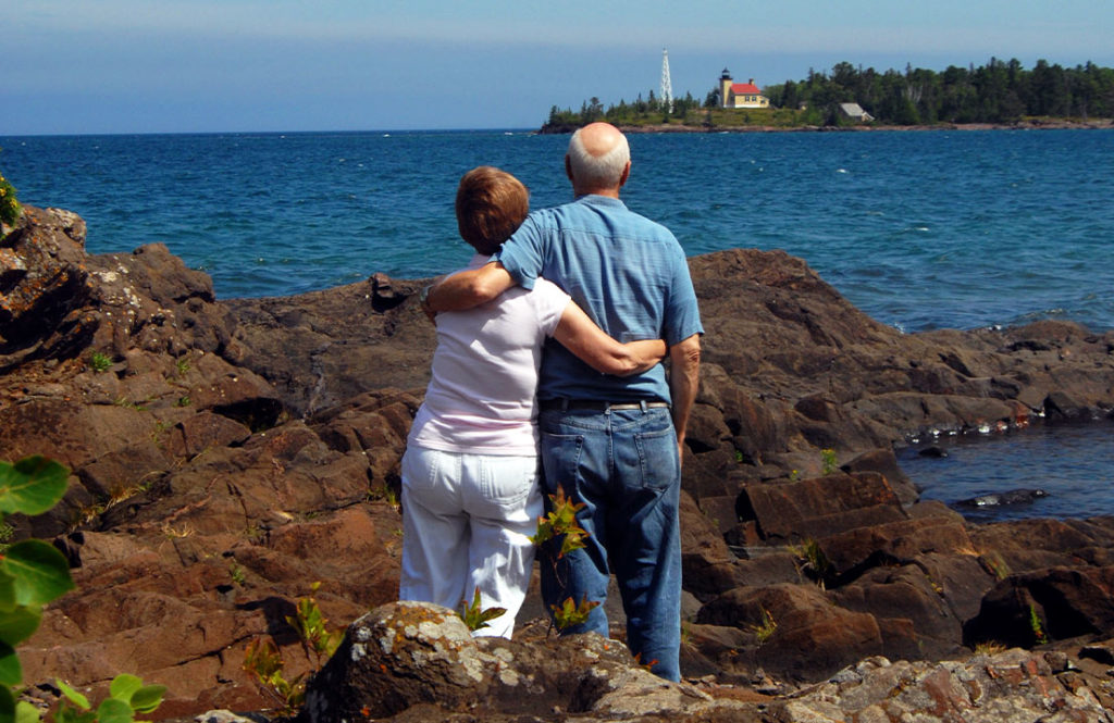 couple embracing looking out over the water what is an annuity safe harbor associates llc