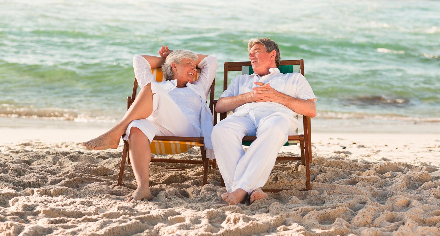 couple relaxing on beach chairs what is an annuity safe harbor associates llc